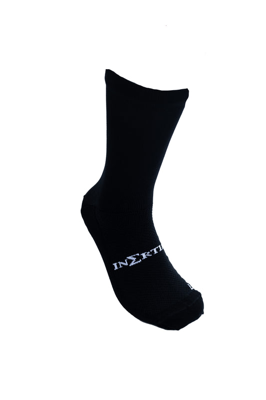 Inertia crew grip socks in black, front view